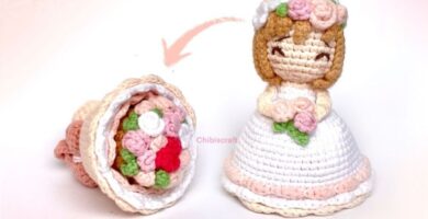 Crochet doll holding a flower, featuring a handmade design and reversible style.