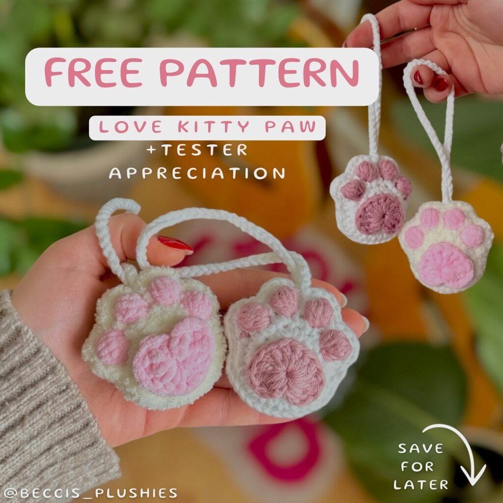 Crocheted cat paws in white and pink, with a loving design, perfect for cat lovers and crafters.